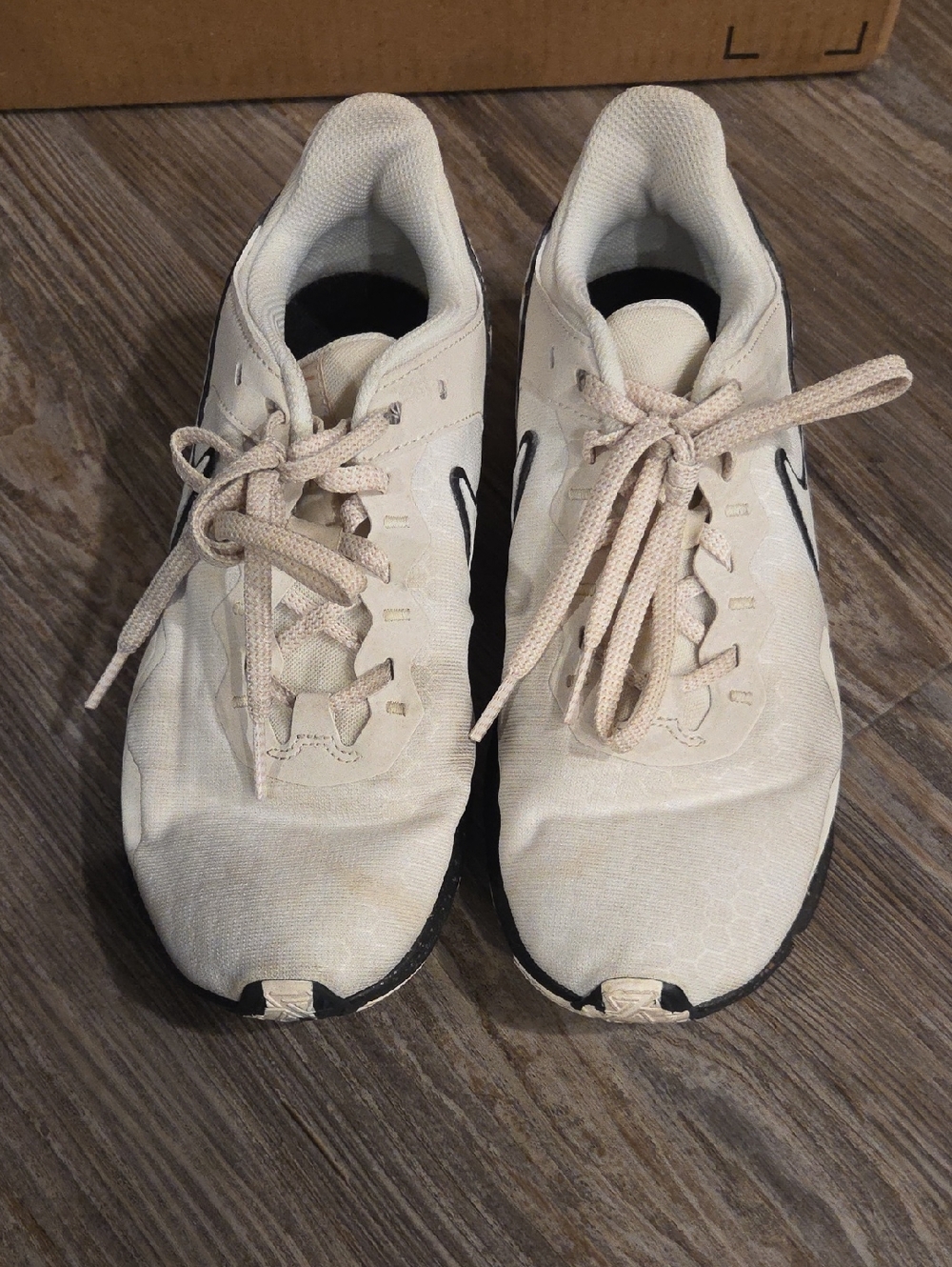 Nike White Beige Athletic Shoes with Black Swoosh